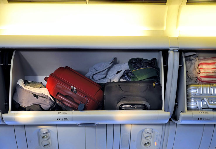 Italy bans the use of overhead bins on some flights © robert paul van beets/Shutterstock