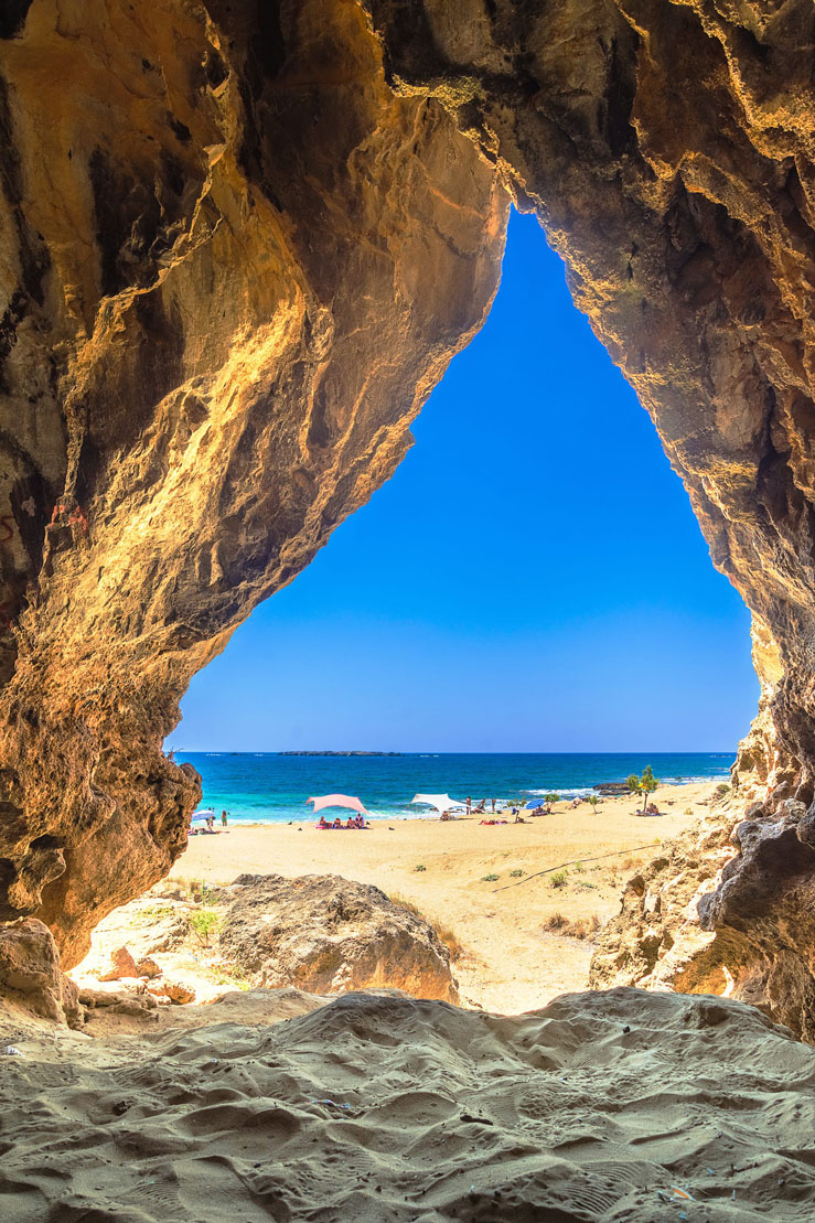 Sandy beach of Falasarna from inside a cave © Gatsi / Getty Images
