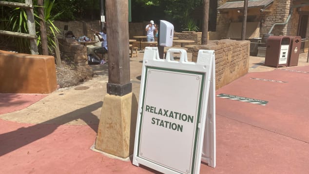 Parkgoers can take off their mask in designated Relaxation Stations. Julie Tremaine for CNN