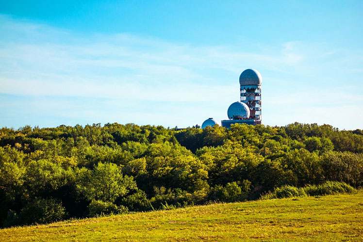 The abandoned listening station on top of Teufelsberg rising above Grunewald Forest © Wondervisuals / Shutterstock